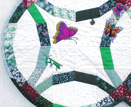 Closeup of machine embroidered Double Wedding Ring.