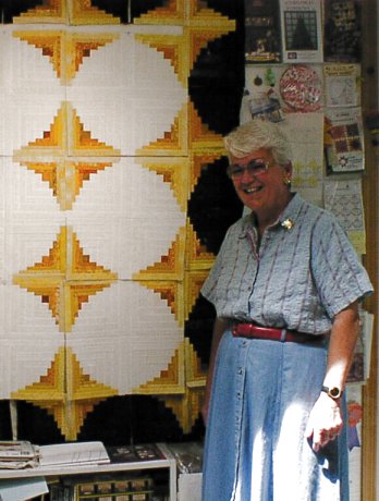 [Mary Peard and her new quilt]