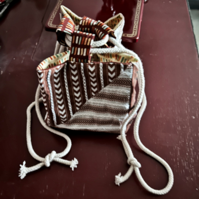 Ticking Stripe print with hand embroidery, made into a Japanese rice bag.