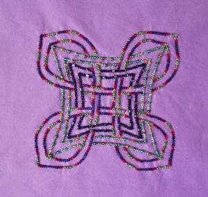 Finished block in Regal Born color background fabric.