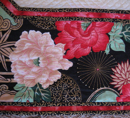 Closeup of Rochelle's snowflake quilt.