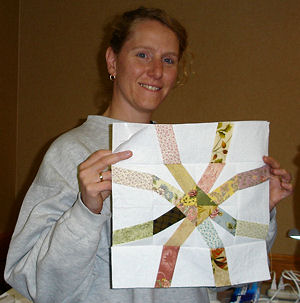 Student holding her block.