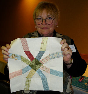 Student holding her block.