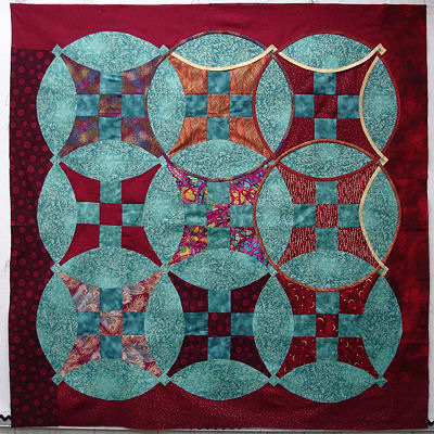 Sonya's red and turquiose quilt top.